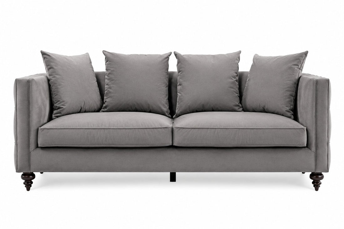 A gray upholstered loveseat with four matching back cushions, shown from the front on a plain white background.
