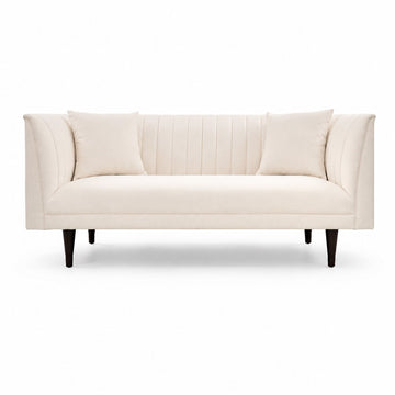 An off-white upholstered loveseat with vertical channel tufting on the backrest, two matching throw pillows, and tapered dark legs, shown against a plain white background.