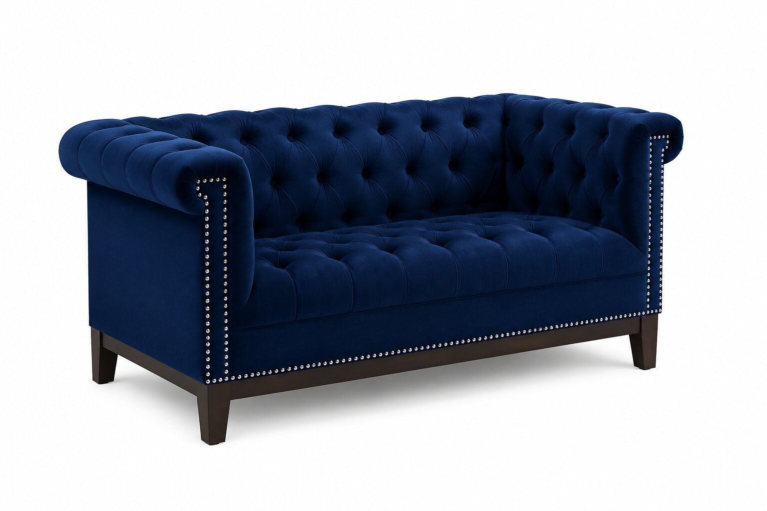 A classic Chesterfield loveseat sofa upholstered in deep navy blue velvet, featuring tufted button detailing, rolled arms, and silver nailhead trim, supported by dark wood legs.
