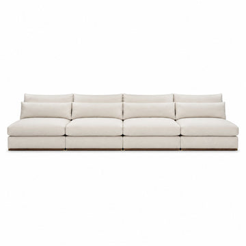 A modern modular sectional sofa upholstered in a light cream or off-white fabric, shown from a straight-on front angle against a solid white background.