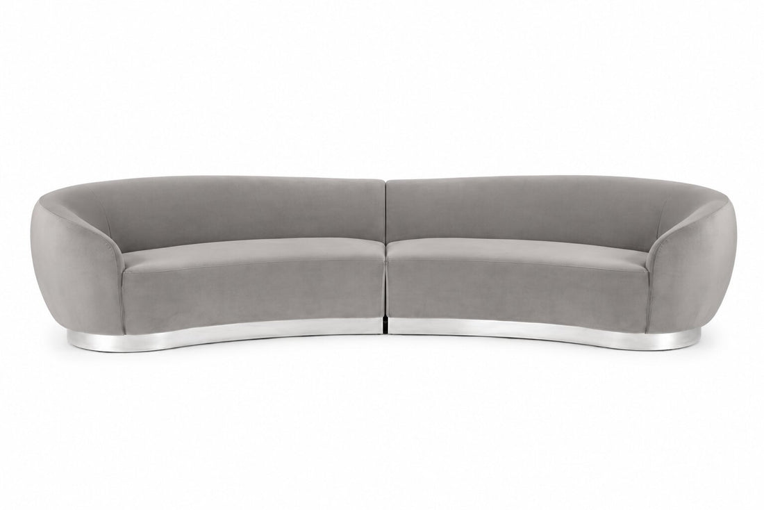 A modern curved two-seater sofa upholstered in light gray fabric with a polished silver metallic base, shown against a plain white background.